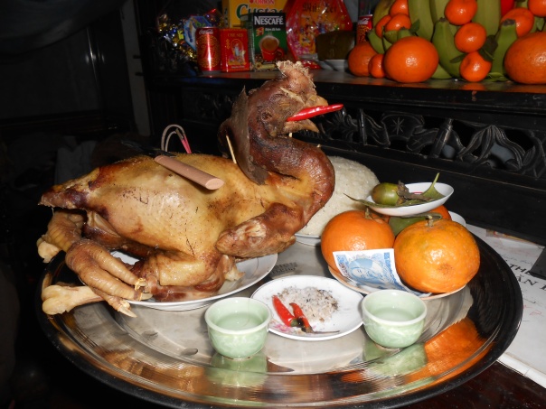 On New Year's Eve a chicken is killed and cooked and put on the altar too... After midnight we all sat down to eat it together.