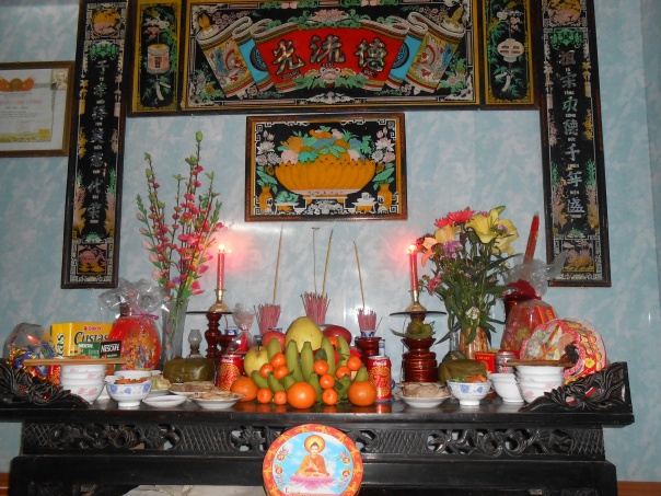 The altar full of food for the dead relatives... Even bowls of rice and meat with chopsticks...